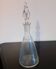 Carafe in chiseled glass and flame-shaped stopper