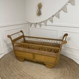 Wooden and rattan baby bed