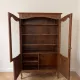 Antique display cabinet in Louis XV style made of wood.