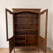 Antique display cabinet in Louis XV style made of wood.