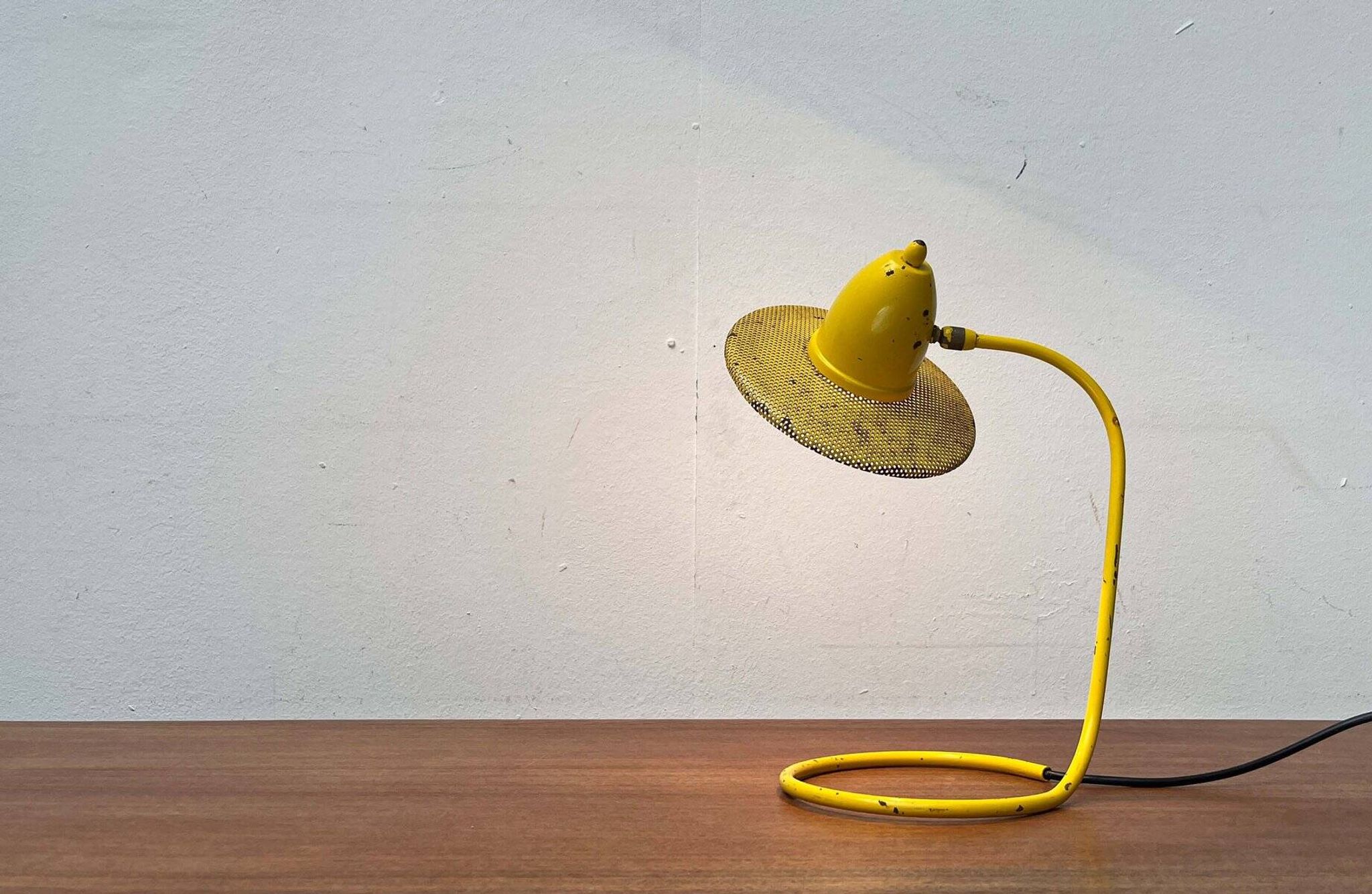 Perforated metal table lamp in Mid-Century Modern style, in the style of Mathieu Matégot, 1960s.