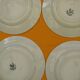Set of 4 flat plates in saint amand earthenware. lily of the valley decor.