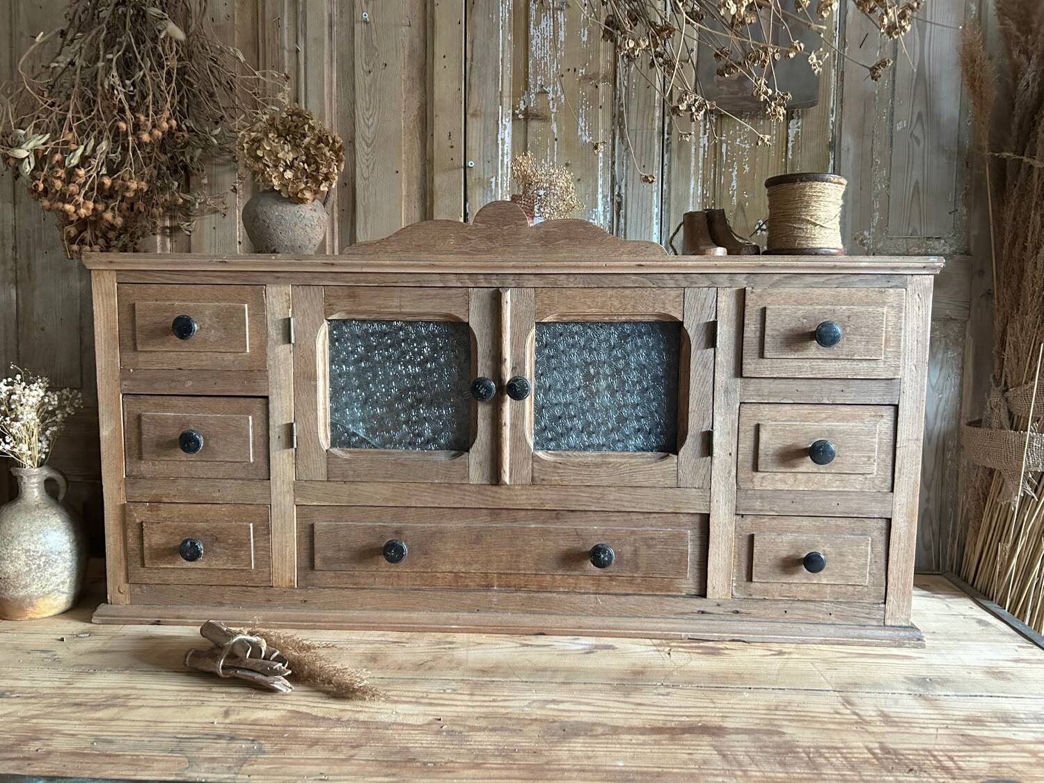 Small piece of furniture with glass doors and drawers