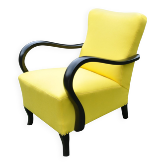 Art Deco armchair in yellow and black, made of painted wood and cotton, high back, 1920s.