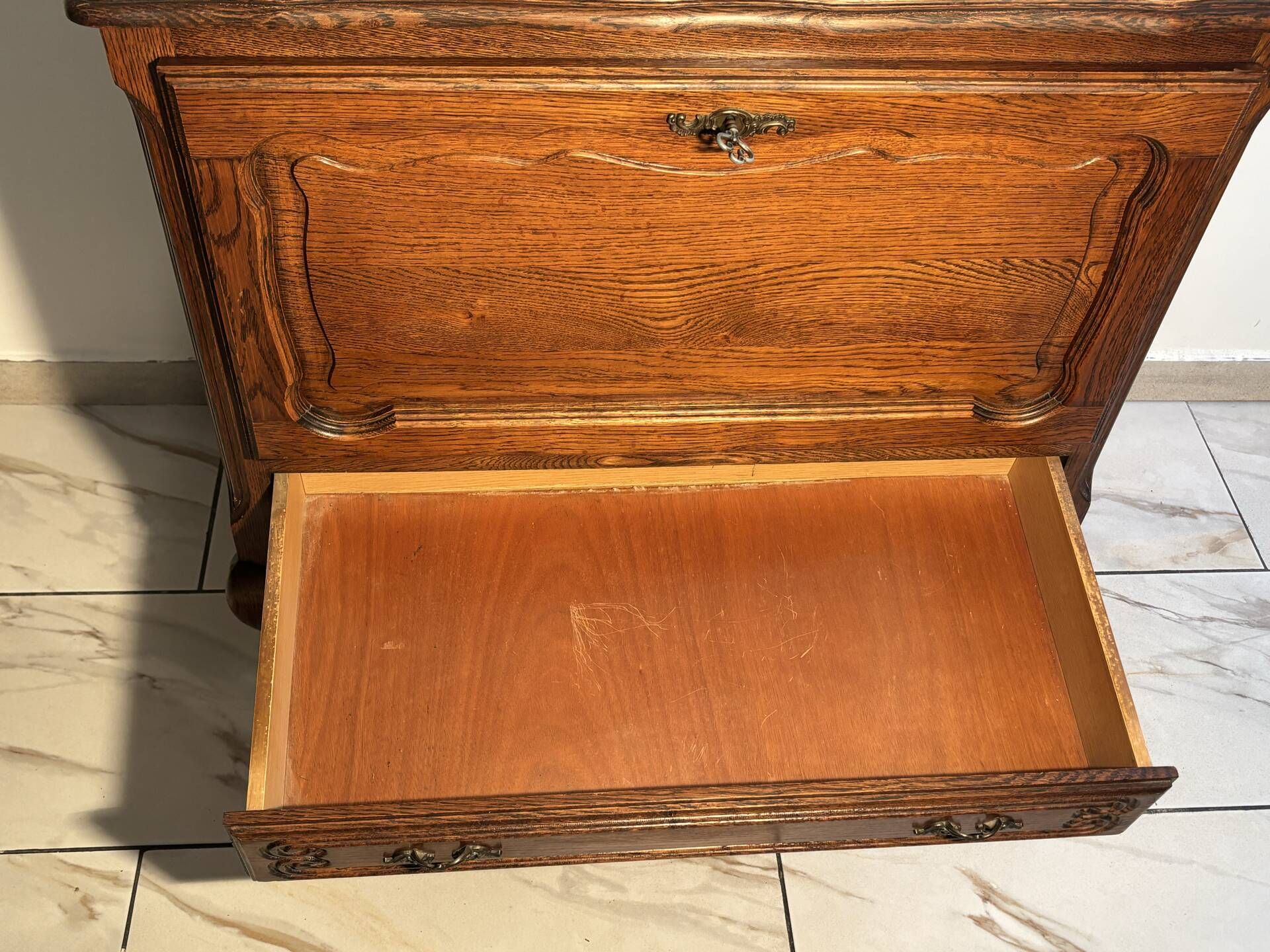 Louis XV style oak TV cabinet with drop-down flap.