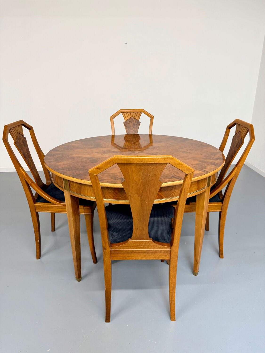 Round walnut Napoleon III extendable table with bronze top in good condition.