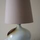 Glazed ceramic ball lamp signed Bossis with a fabric shade.