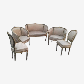 Salon doré deux fauteuils et un canapé forme gondole et une paire de chaises Louis XVI