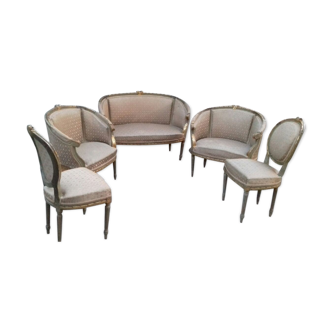 Salon doré deux fauteuils et un canapé forme gondole et une paire de chaises Louis XVI