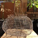 Old egg basket in metal shape round metal handle