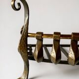 Old cast iron and brass log holder