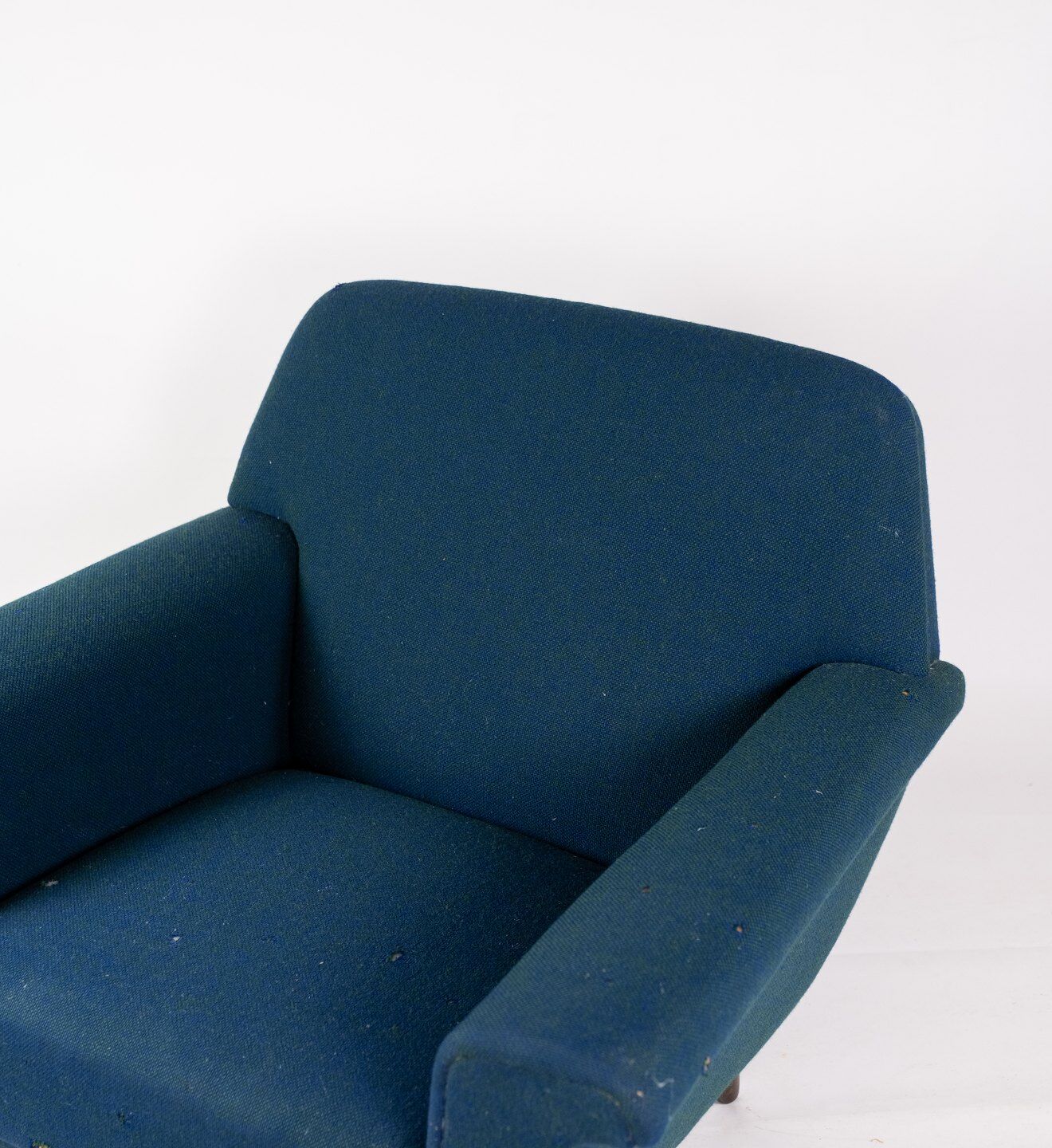 Armchair upholstered with dark blue wool fabric and legs in dark wood, of danish design, 1960s