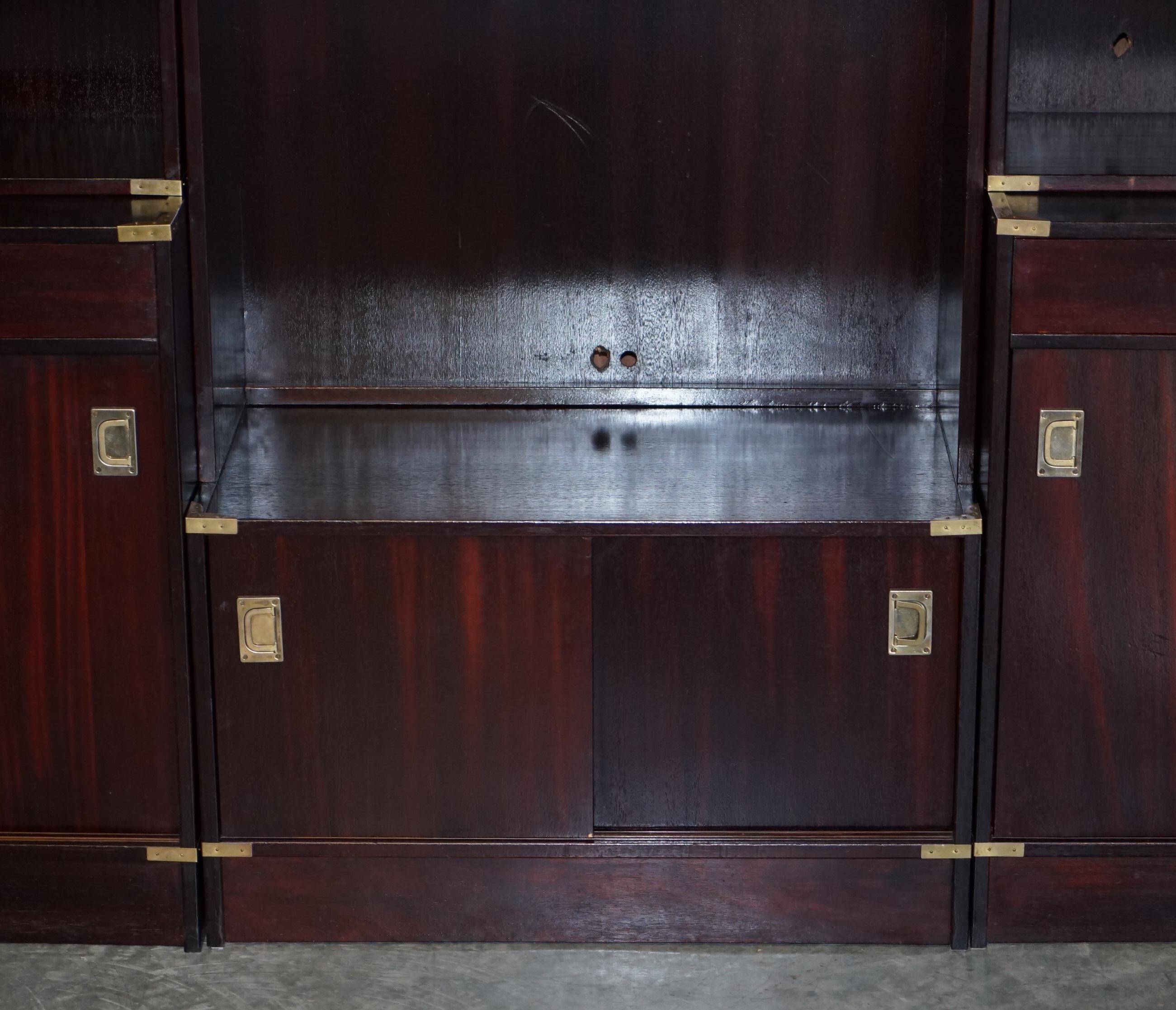 Three vintage style Military Campaign bookshelves, mahogany finish.