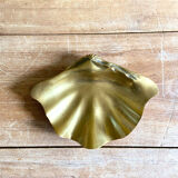 Large empty pocket in the shape of a golden brass shell