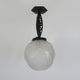 Art Deco hanging lamp in wrought iron Fournet and globe in glass paste
