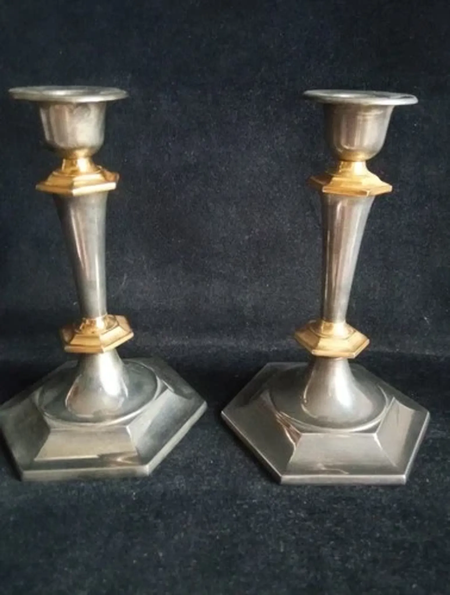 Pair of small English candlesticks in silver-plated metal and brass - 20th century.