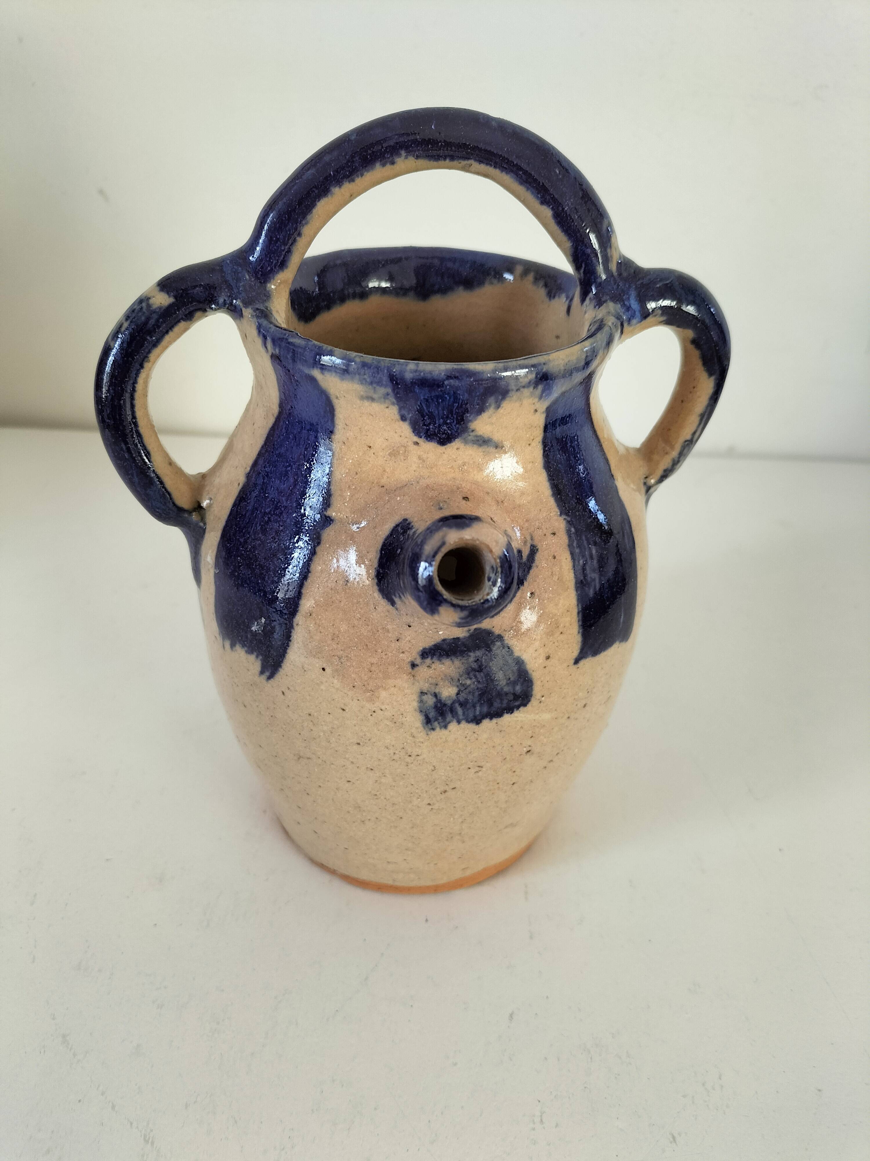 Old pitcher (goat) in cobalt glazed earthenware
