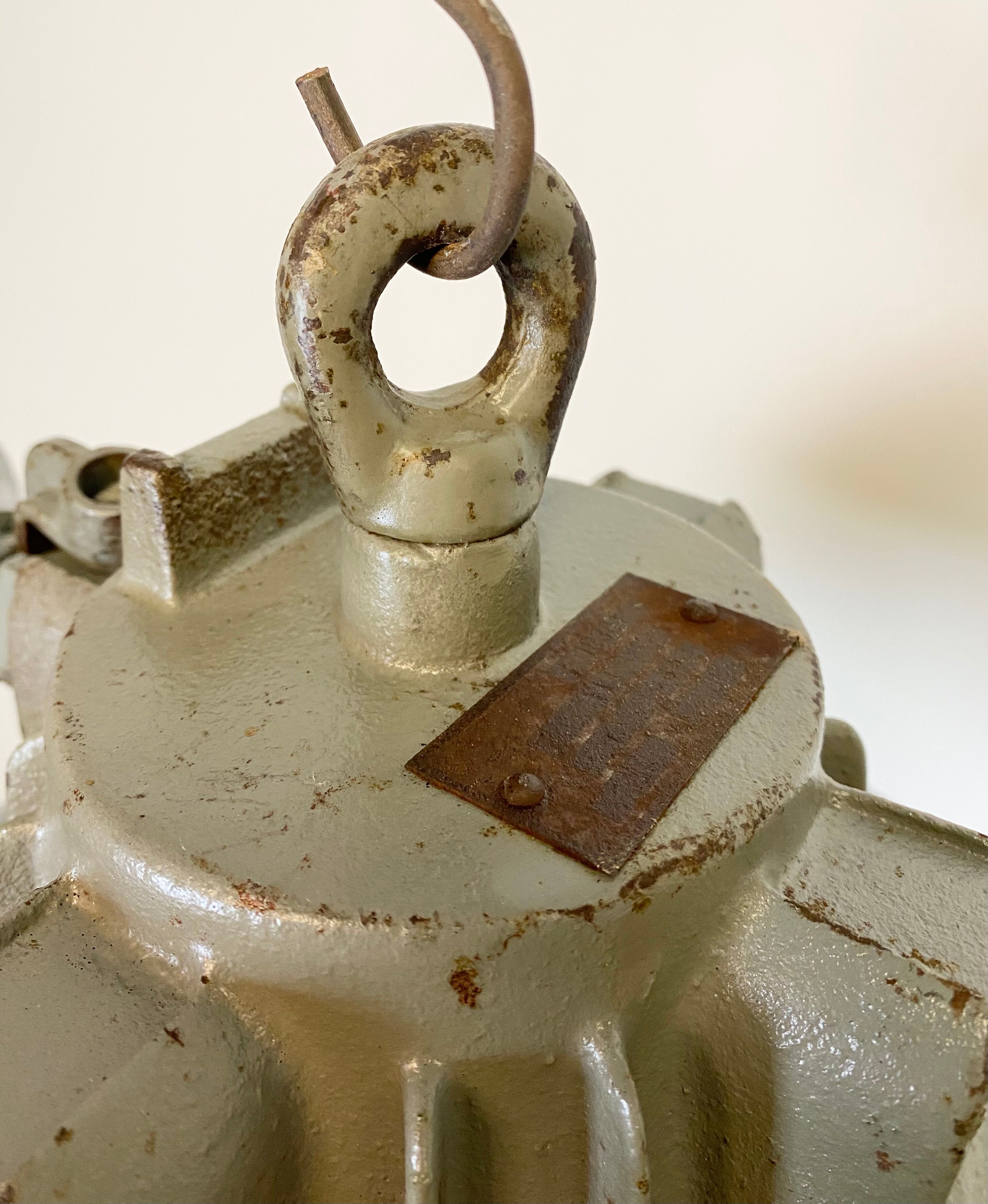 Black enamel and cast iron industrial cage pendant light , 1950s