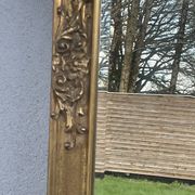 vintage bevelled mirror in rectangular shape, stucco and gilded wood in Louis XV baroque style