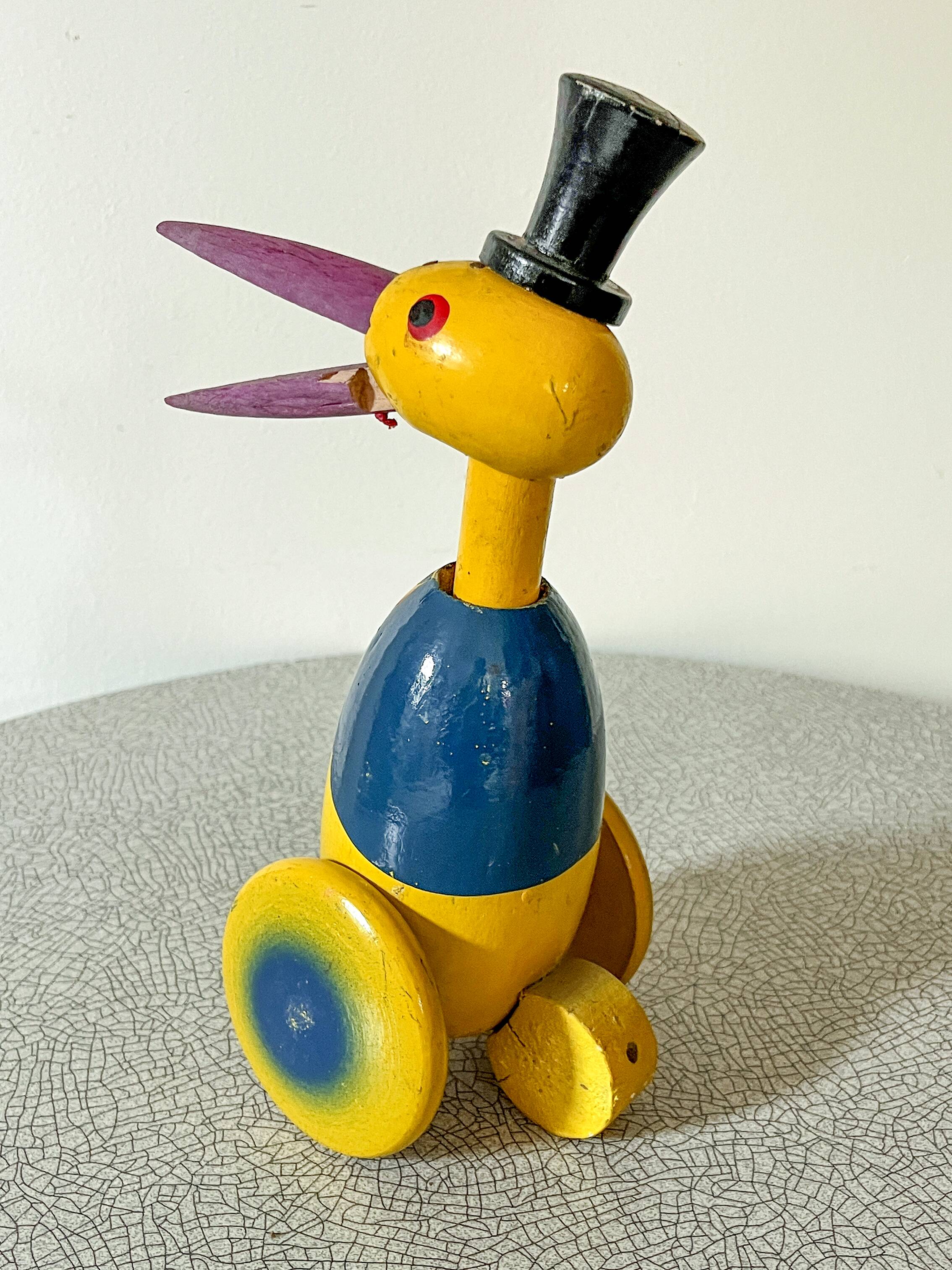 Old push toy, wooden stork
