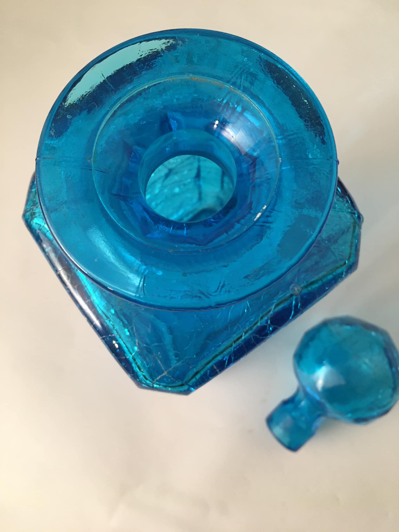 Blue glass bottle with glass cap