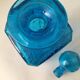 Blue glass bottle with glass cap