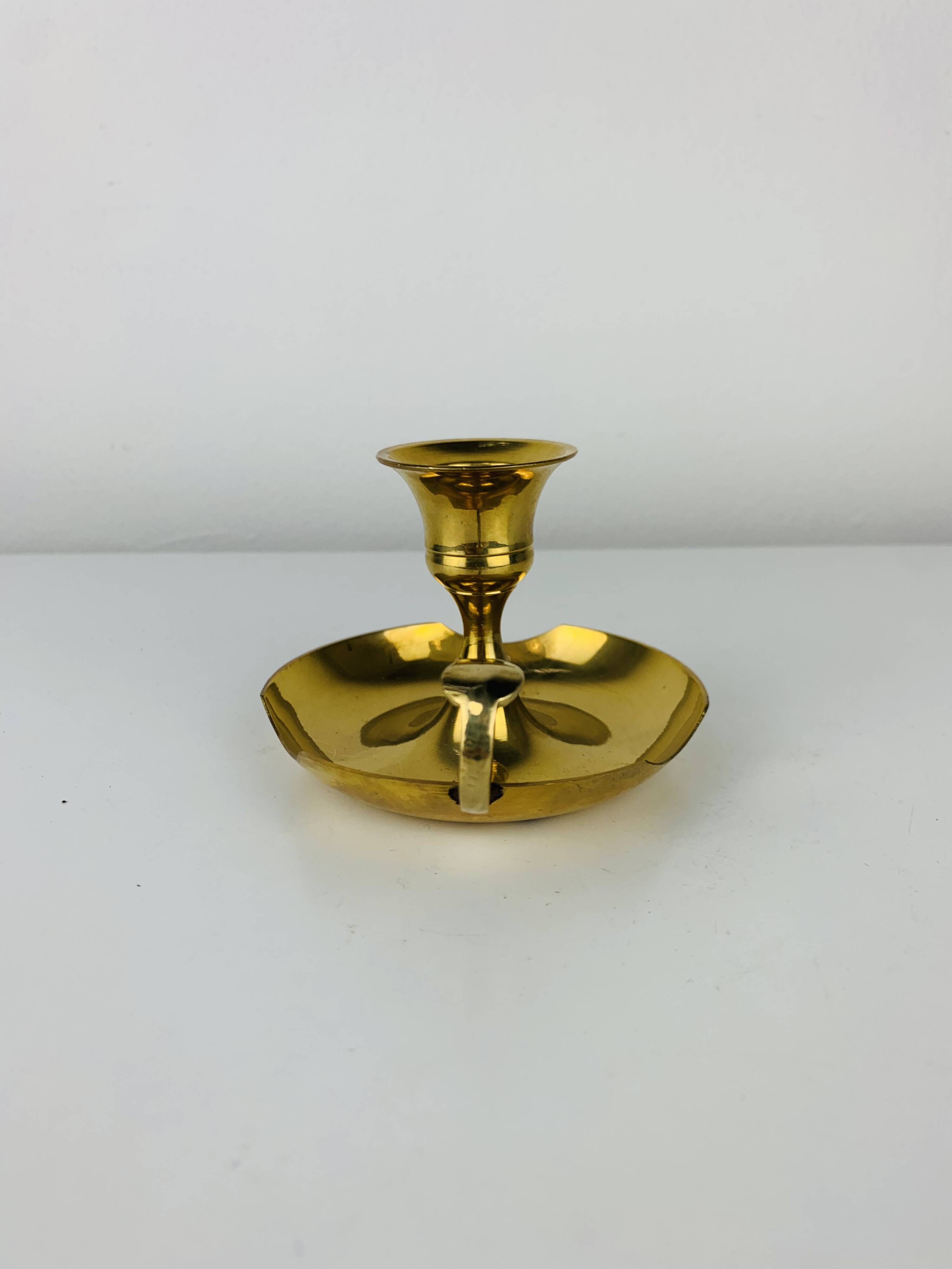 Golden brass candlestick rat of the cellar