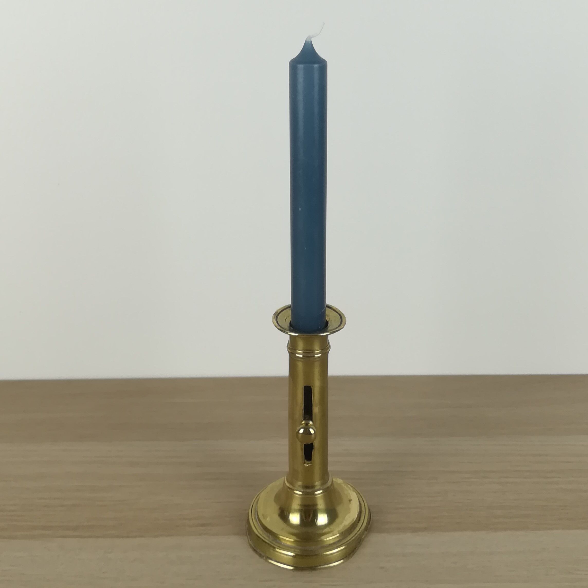 Brass pusher candle holder