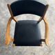 Set of 2 vintage beech wood armchairs with black skai upholstery — mid-century modern