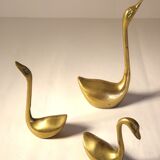 Trio of brass swans
