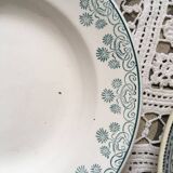 Together six old plates are mismatched in green