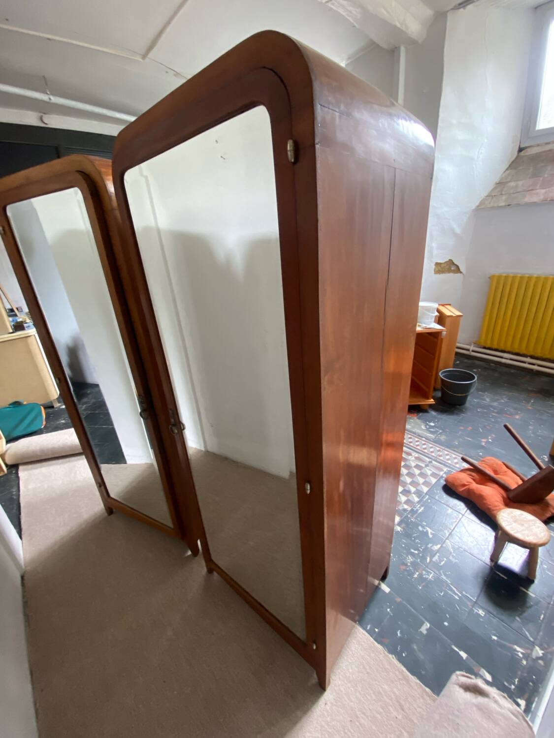 Pair of rounded mirrored wardrobes