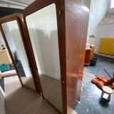 Pair of rounded mirrored wardrobes