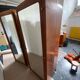 Pair of rounded mirrored wardrobes