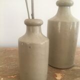 Three bottles of Mercure Bourdon Frères Paris sandstone