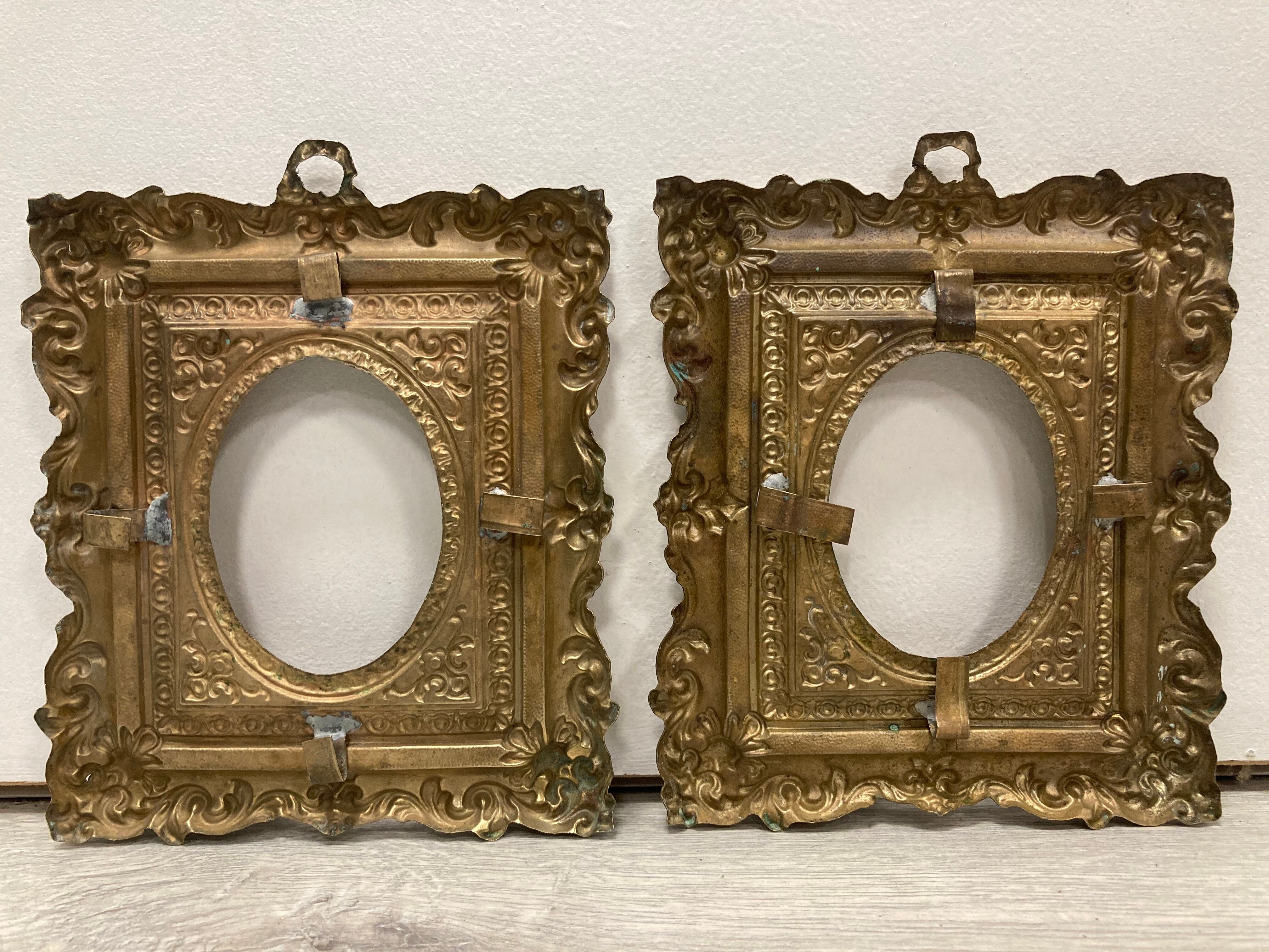 Pair of brass photo frames