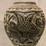 Terracotta vase with green digging patina with animal decoration