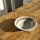 Small earthenware bowl from Italy, white with brown, green, and orange trim, D24.5.