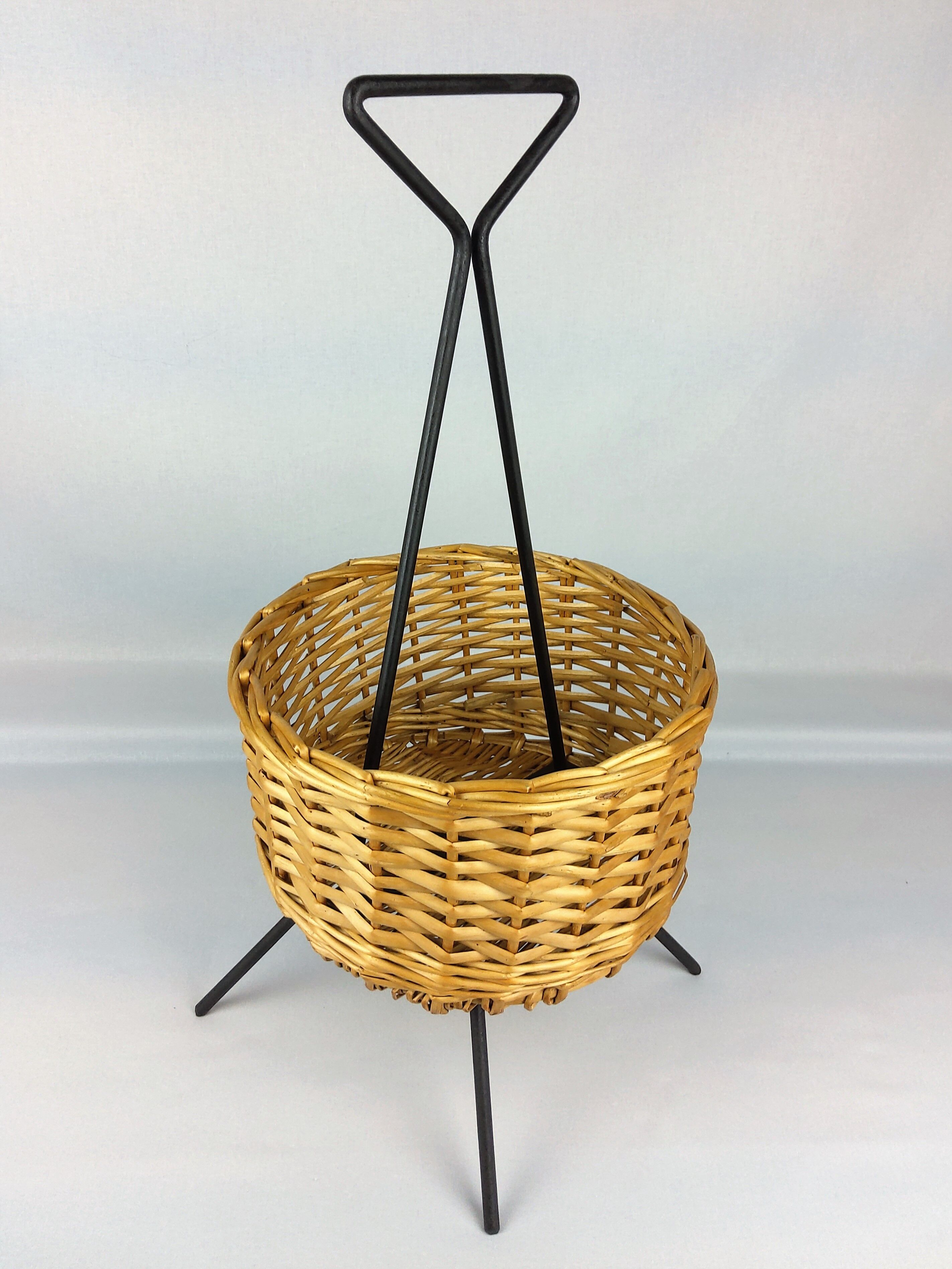 Black metal rattan trash can on 1960