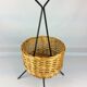 Black metal rattan trash can on 1960