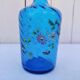 Vintage twisted blue glass carafe with enamel decoration.