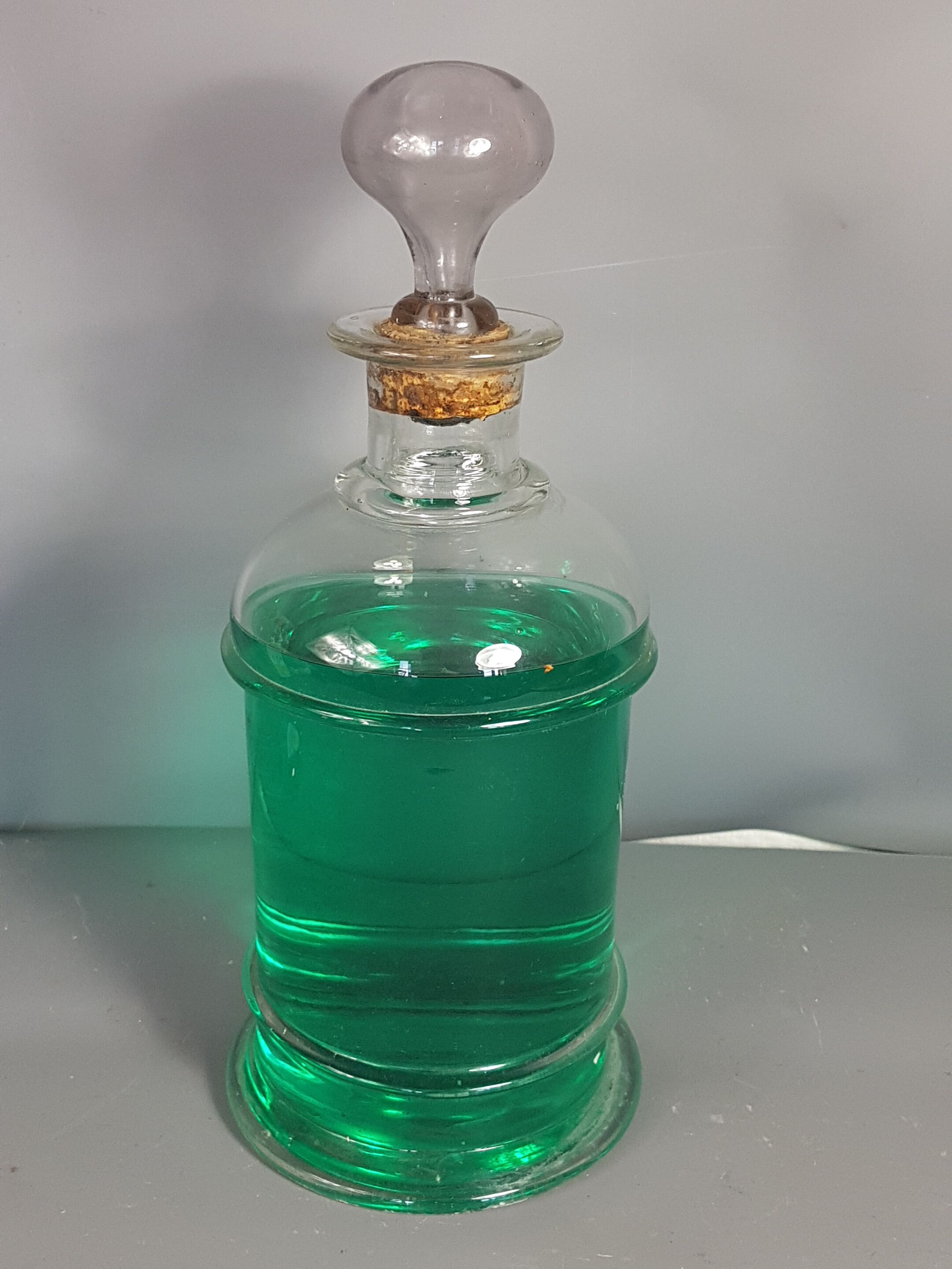Old bottle of 19th century blown glass