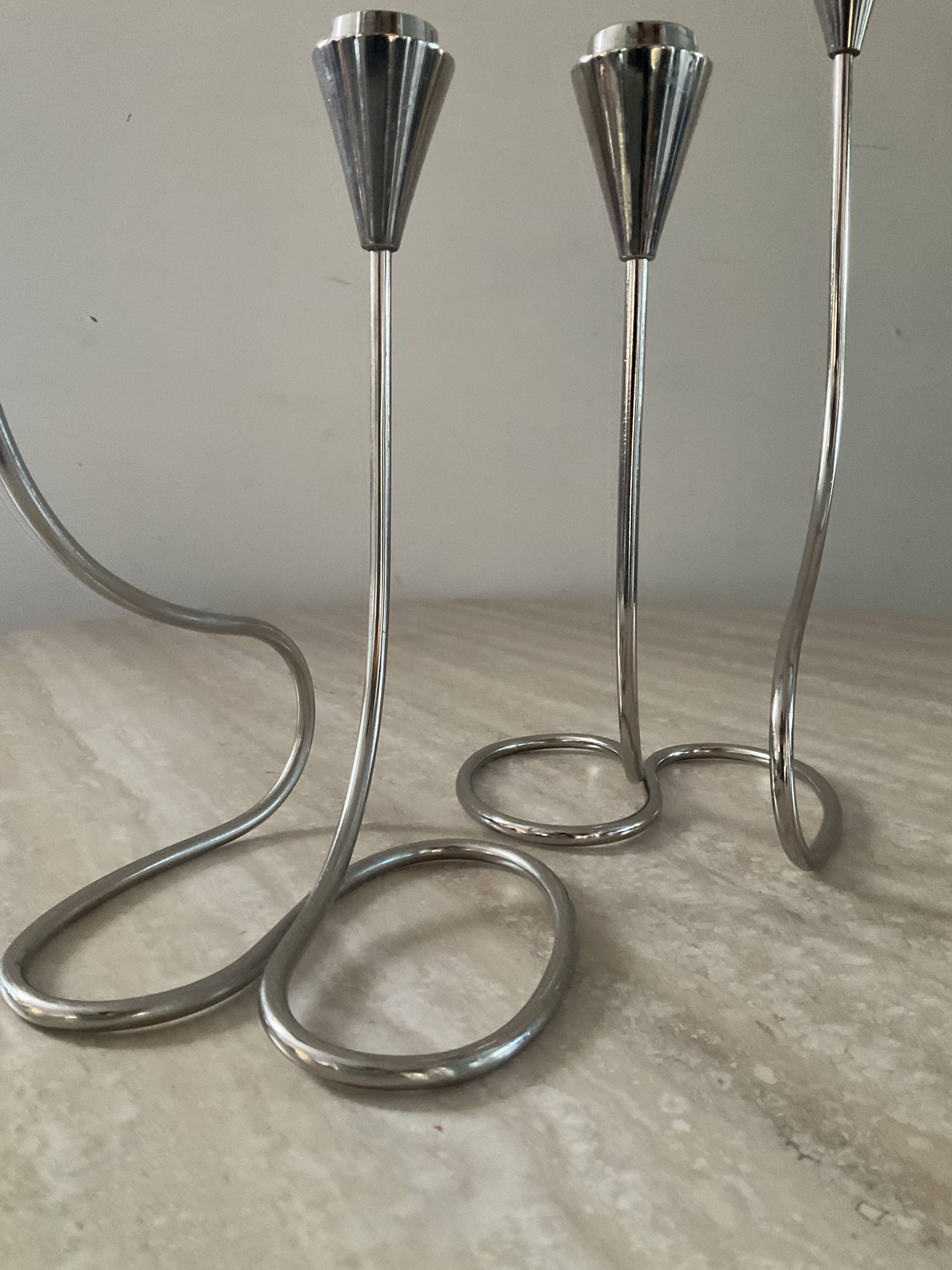 Pair of modernist silver metal candlesticks