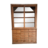 Antique haberdashery cabinet in French oak with drawers and display case, circa 1880–1900.