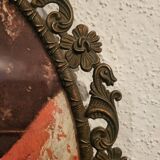 Italian oval frame in bronze and curved glass