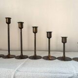 Set of 7 vintage brass candlesticks.