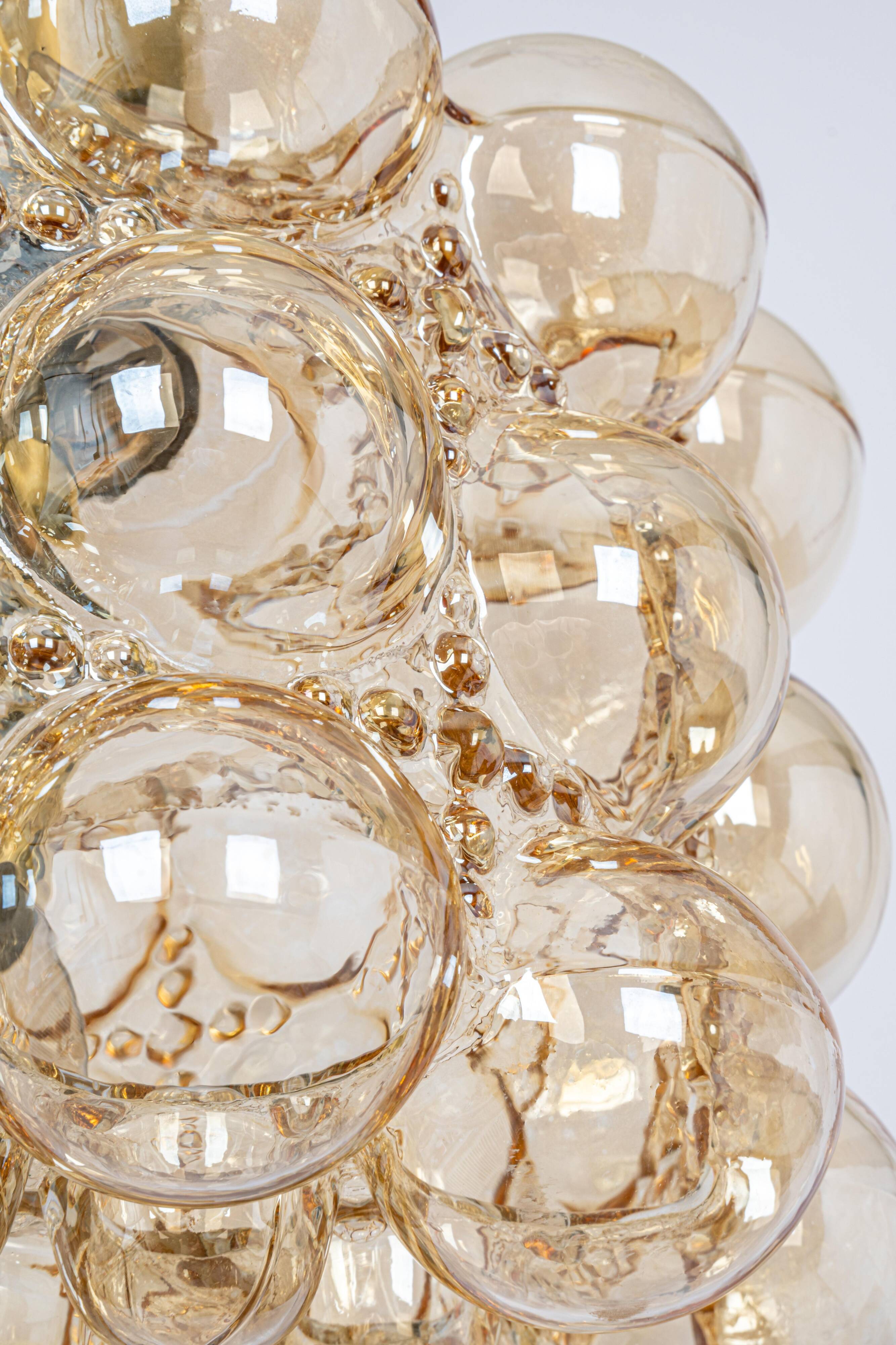 Large amber bubble glass pendant by Helena Tynell for Limburg, Germany, 1970s.