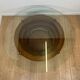 Sculptural coffee table with concentric rings, glass and wood, circa 1985.