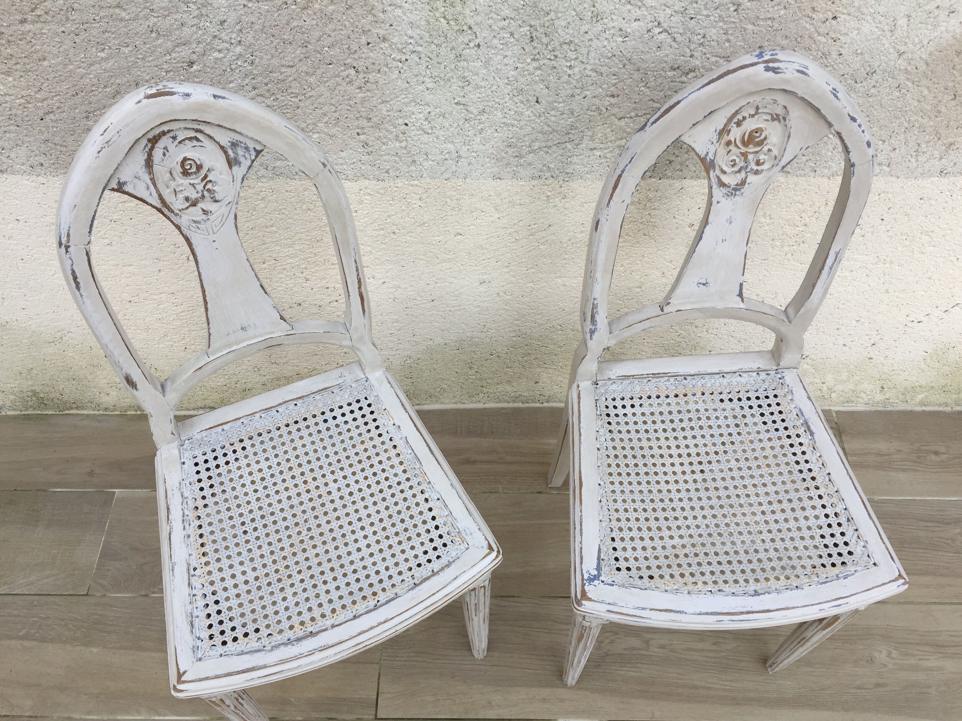 Pair of old white canne chairs