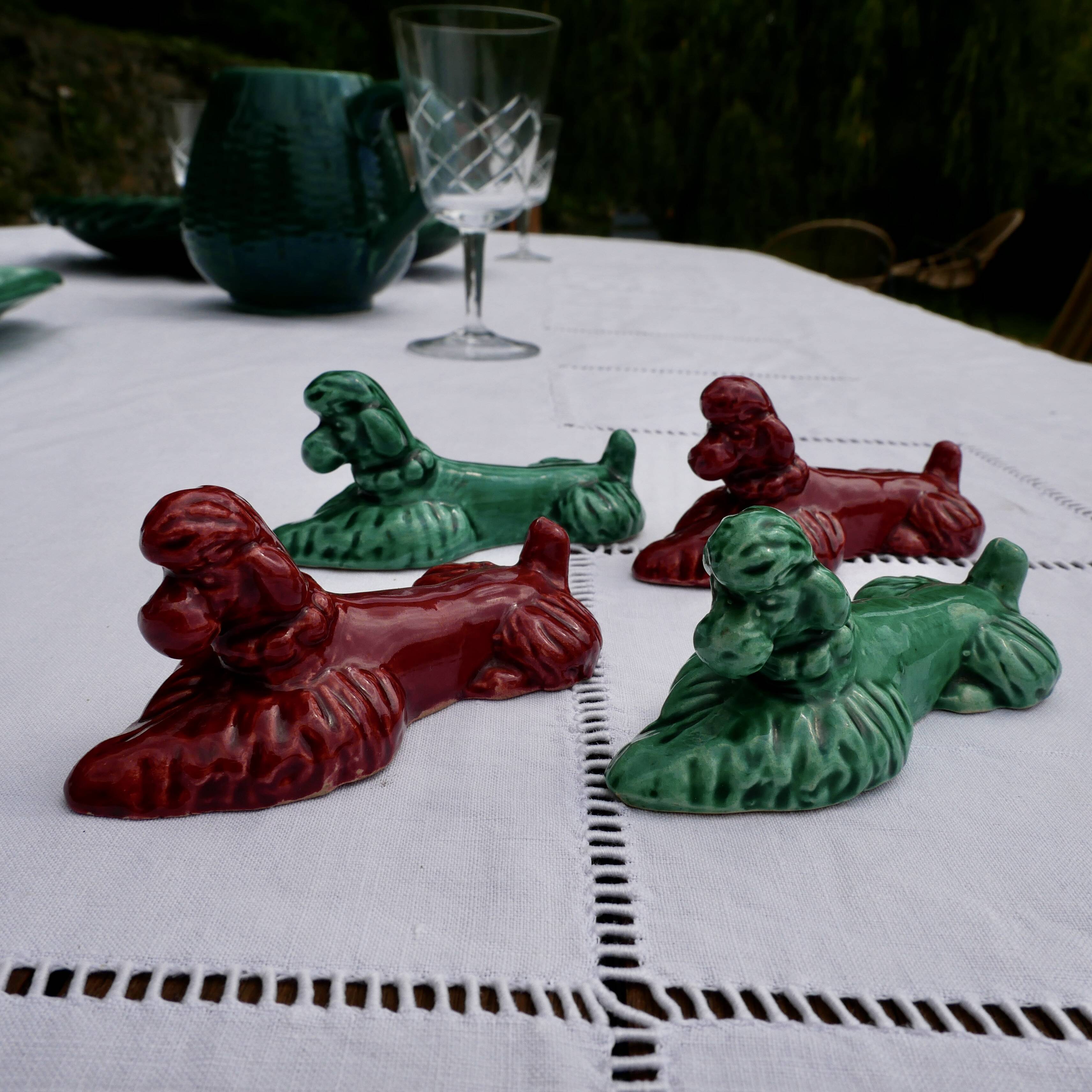 4 knife holders in the shape of poodles